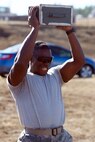 The Marine CFT requires participants in battle dress uniform, to sprint a timed 880 yards, lift a 30-pound ammunition can overhead from shoulder height repeatedly for two minutes, and perform a timed maneuver-under-fire event.