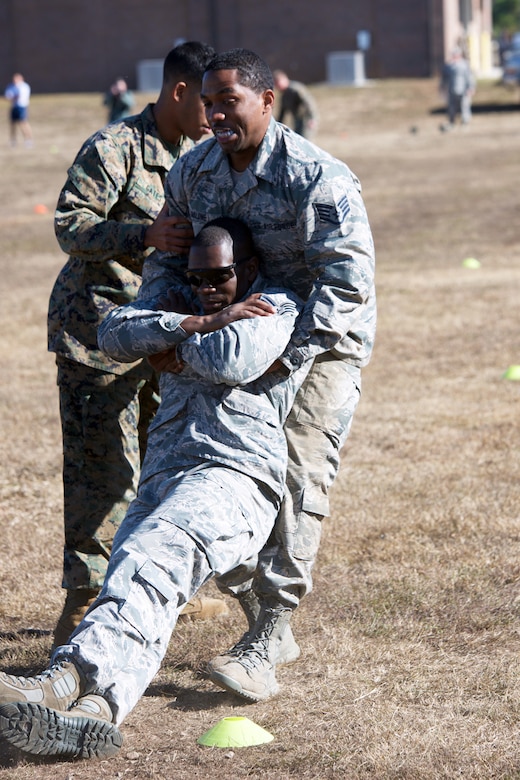 The Marine CFT requires participants in battle dress uniform, to sprint a timed 880 yards, lift a 30-pound ammunition can overhead from shoulder height repeatedly for two minutes, and perform a timed maneuver-under-fire event.