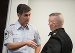 Air Force Chief Master Sgt. Ronald Thompson, senior enlisted leader of the chief of staff of the Air Force's Focus Area 2, speaks with Army Command Sgt. Maj. John W. Troxell, senior enlisted advisor to the chairman of the Joint Chiefs of Staff, before an Enlisted Military Education Review Council meeting at National Defense University in Washington, Nov. 20, 2017. The council met to discuss joint enlisted leader development, talent management and service education initiatives. DoD photo by Army Sgt. James K. McCann