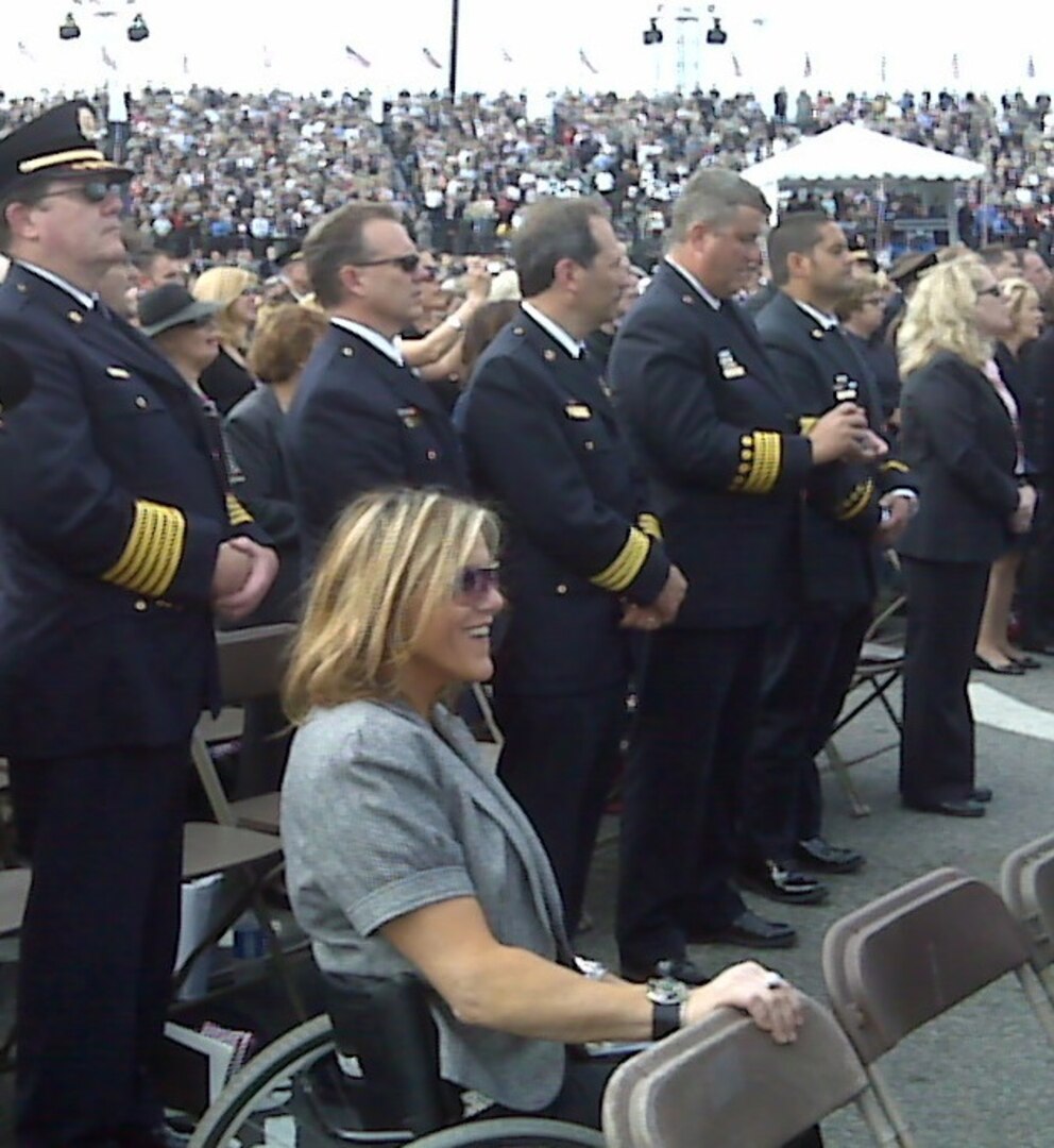Carlana Stone (center), seen here in attendance at the Pentagon Memorial Dedication Ceremony on Sept. 11, 2008, is scheduled to speak Army Soldiers and units on Dec. 8 as part of the U.S. Army North (Fifth Army) and the Army’s Ready and Resilient program. Stone lost the use of her legs in an accident when she was 16 years old and shares her story of recuperation and triumph to motivate and empower others with their own struggles.