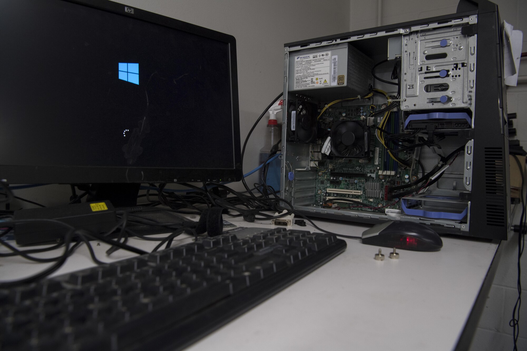 A worker for the West Virginia Department of Education resets a computer to factory settings as part of the SecondLaunch Program Nov. 28, 2017 in Charleston, W.Va. The SecondLaunch Program has saved the DOE approximately $1 million per year by repurposing used technology for schools across the state. (U.S. Air National Guard photo by Airman Caleb Vance)