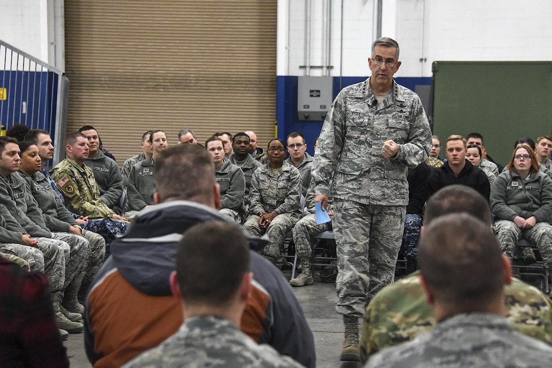 The commander of U.S. Strategic Command speaks with civilians and service members.
