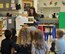 Avery Tibbets, daughter of Brig. Gen. Paul W. Tibbets IV, deputy commander, Air Force Global Strike Command, reads her book “While Daddy’s Away,” to preschool-aged children at the Child Development Center at Barksdale AFB, Louisiana. (U.S. Air Force photo/Joe Thomas)