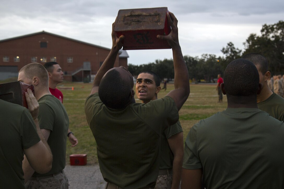 Marine recruits complete ammunition can lifts.