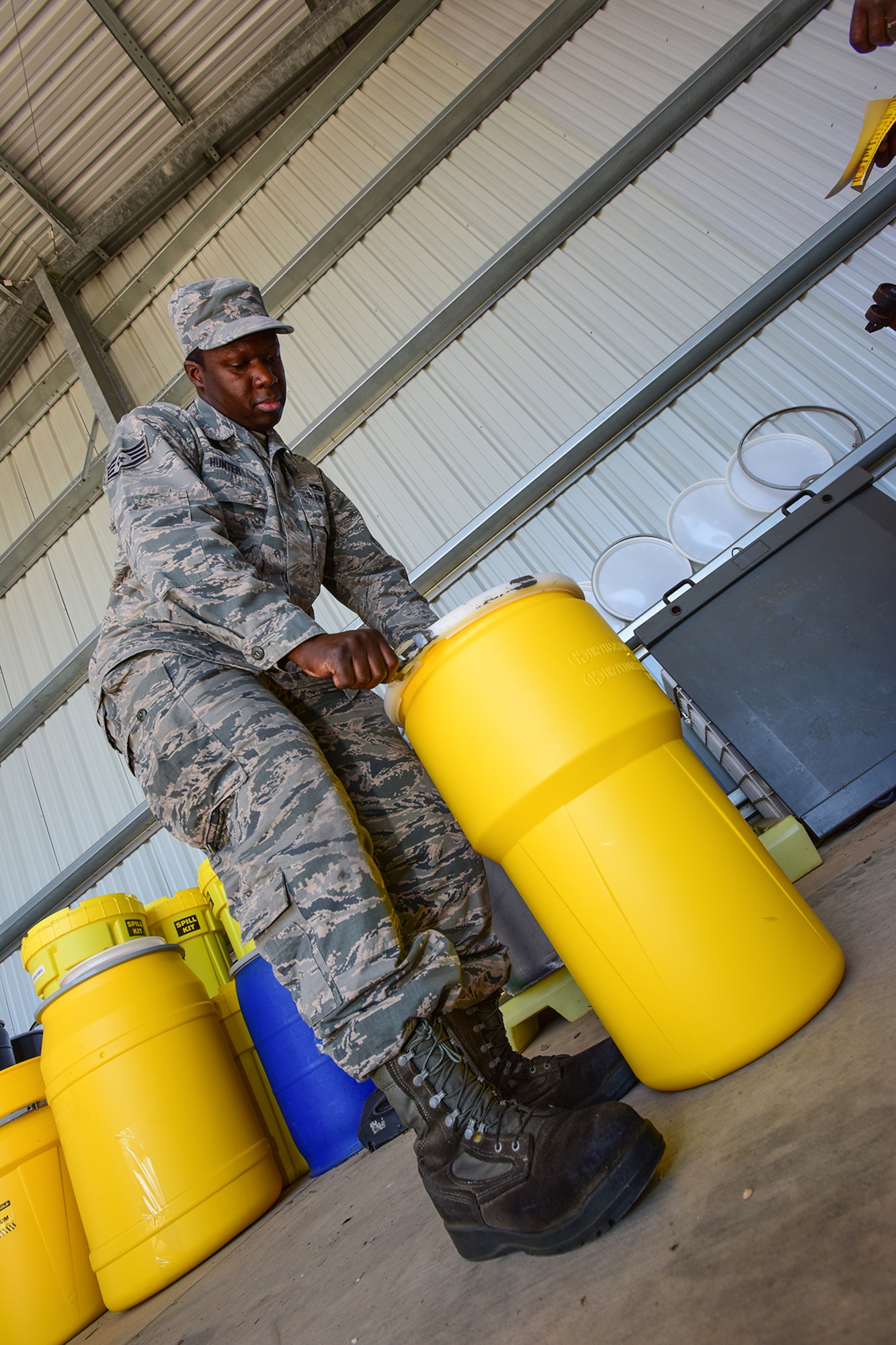 U.S. Air Force Staff Sgt. Christopher Hunter, a crew chief assigned to the 169th Aircraft Maintenance Squadron, drops off materials for disposal at the Central Acquisition Point drop-off center at McEntire Joint National Guard Base, S.C., Nov. 16, 2017. This is one of the programs that the 169th Fighter Wing at McEntire offers in order to assist in keeping the community clean by recycling excess materials. (U.S. Air National Guard photo by Senior Airman Megan Floyd)