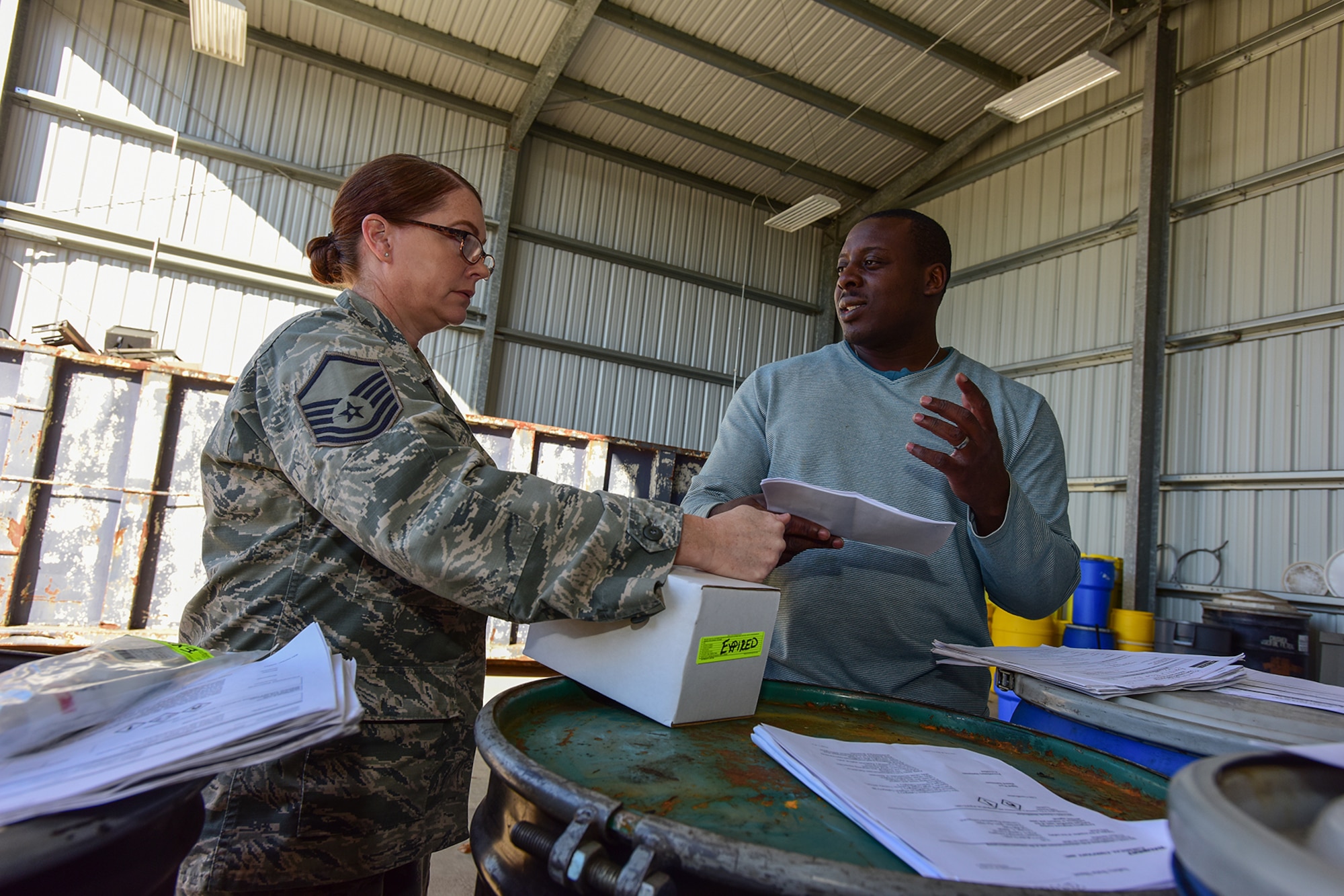 U.S. Air Force Master Sgt. Tabitha Little, a hazmart pharmacy technician assigned to the 169th Logistics Readiness Squadron, drops off materials for disposal at the Central Acquisition Point drop-off center at McEntire Joint National Guard Base, S.C., Nov. 16, 2017. This is one of the programs that the 169th Fighter Wing at McEntire offers in order to assist in keeping the community clean by recycling excess materials. (U.S. Air National Guard photo by Senior Airman Megan Floyd)