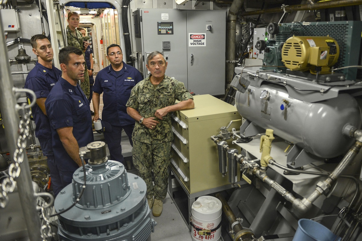 The commander of U.S. Pacific Command visits an engine room on a new cutter.