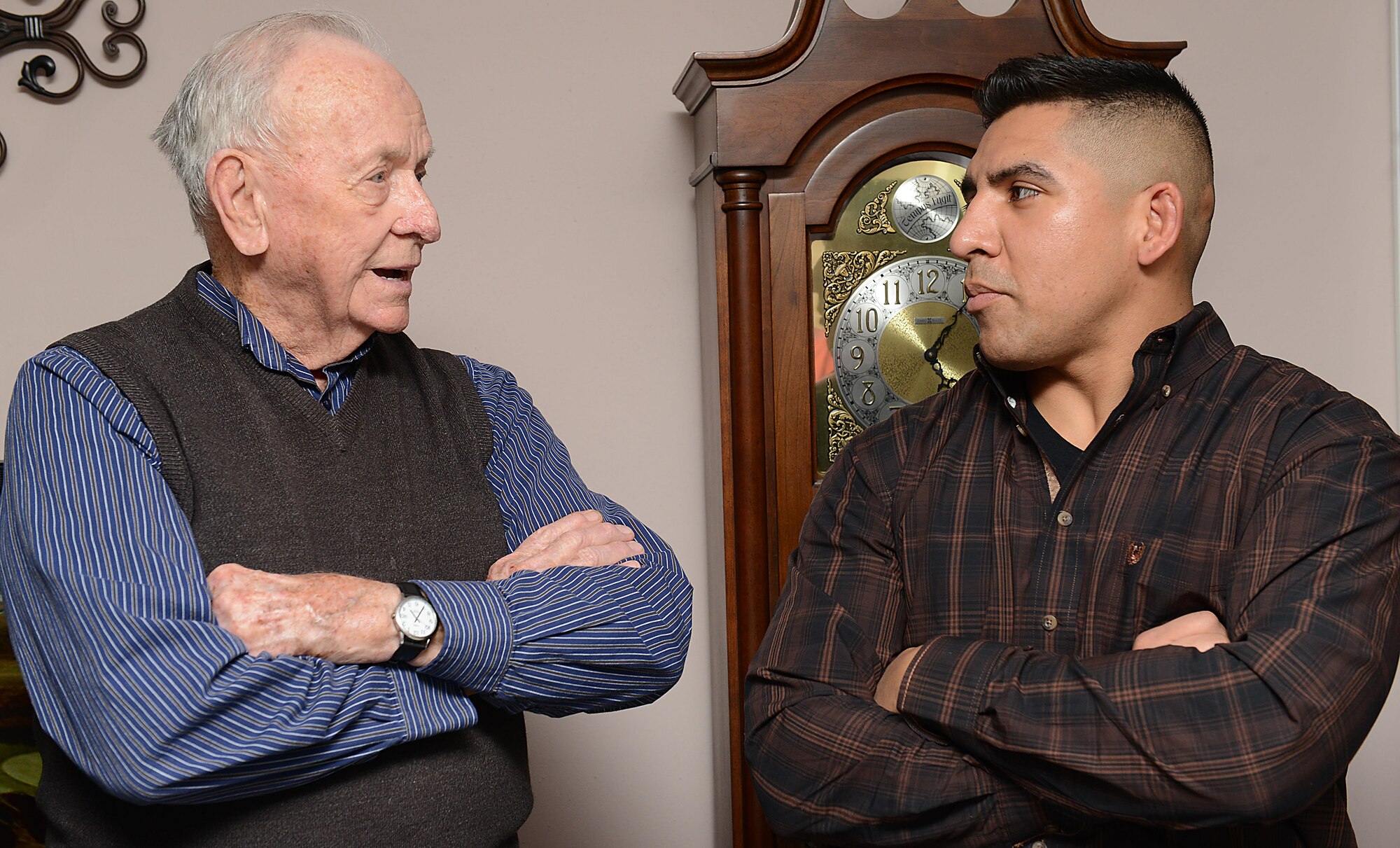 Mark Flockhart, U.S. Air Force Hospital Langley volunteer, and U.S. Army Spc. Efrain Luna, 128th Aviation Brigade Advanced Individual Training student, discuss military culture in Yorktown, Va., Nov. 23, 2017.