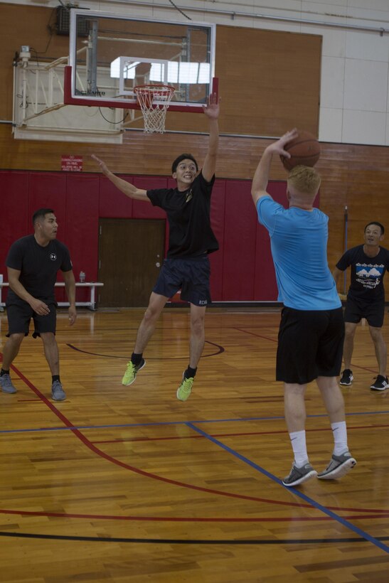 CAMP KINSER, OKINAWA, Japan— A member of the Japan Ground Self-Defense Force jumps to block a shot during a basketball game Nov. 27 aboard Camp Kinser, Okinawa, Japan.