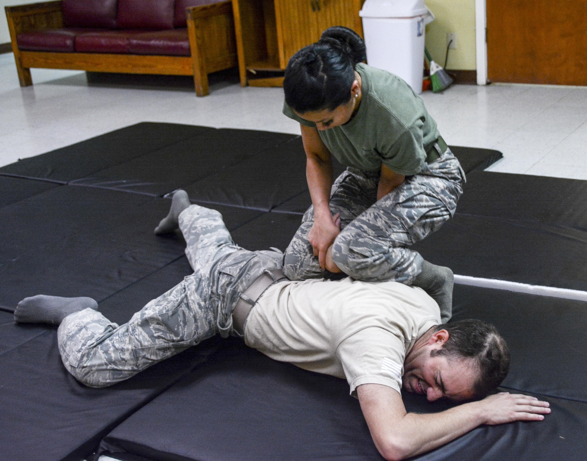 U.S. Air Force Capt.  Elizabeth Guidara , 315th Training Squadron student, demonstrates combative techniques on U.S. Air Force Capt. Justin Arbogast, 315th Training Squadron student, during her course at the local women’s shelter San Angelo, TX, Oct 21, 2017. Guidara initiated the program to teach women skills and techniques against physical intimidation.