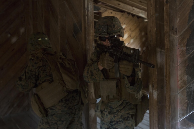 Marines with 1st Battalion, 2nd Marine Regiment clear a room during a military operations on urbanized terrain exercise at Marine Corps Base Camp Lejeune, N.C., Nov. 21, 2017. The Marines conducted MOUT training to maintain combat readiness. (U.S. Marine Corps photo by Lance Cpl. Ashley McLaughlin)