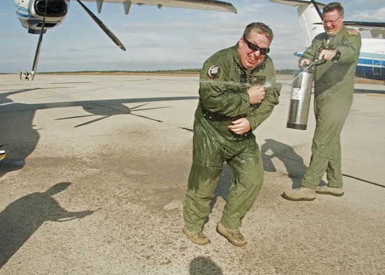 Master Sgt. Glenn Miller, 859th Special Operations Squadron, reacts as he is hosed down by fellow Airmen