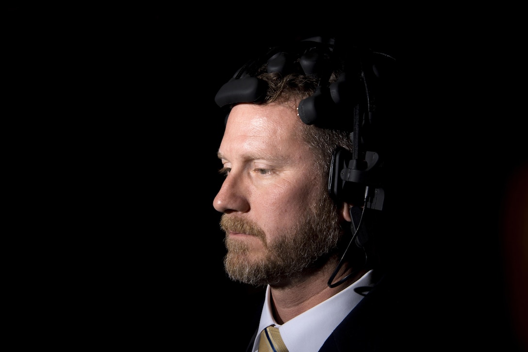 Chad Rodarmer, traumatic brain injury clinic program manager, wears a neurocognitive eye tracking device during a demonstration to show how the device works at Naval Medical Center San Diego, Calif., Sept. 15, 2017. DoD photo by EJ Hersom