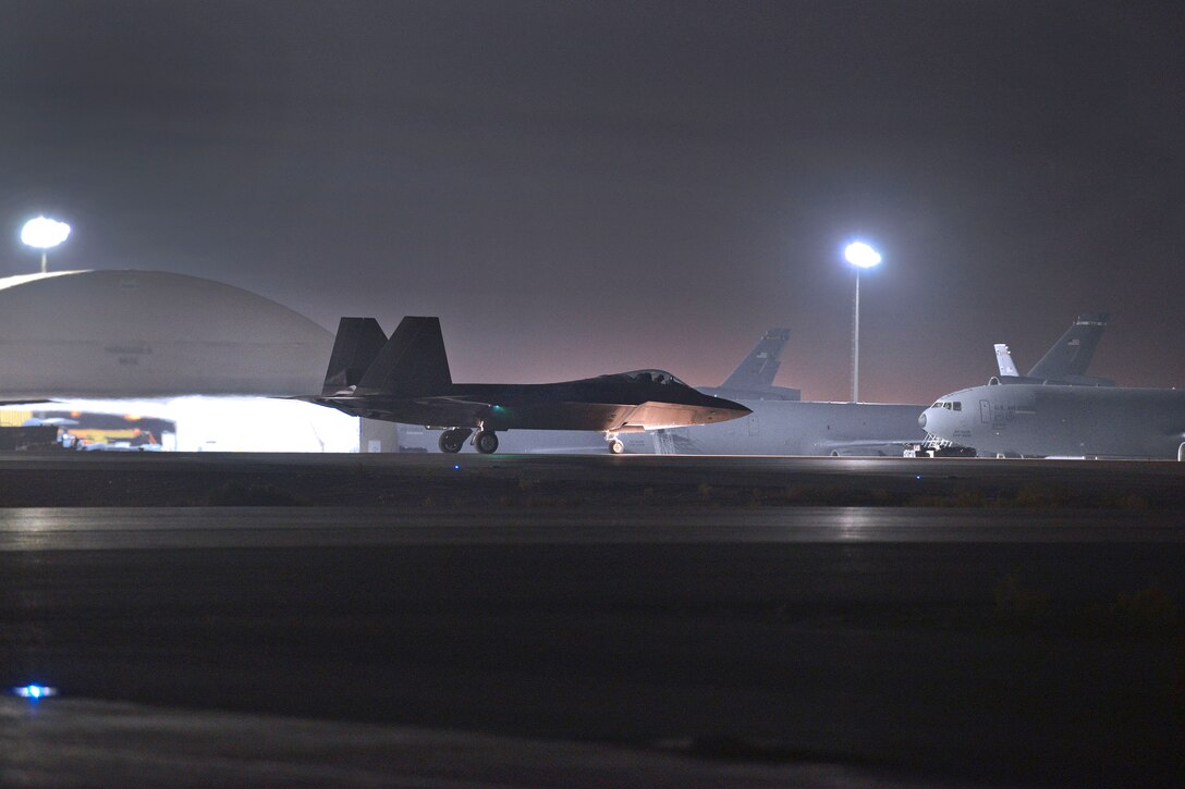 An F-22 Raptor taxis during Operation Jagged Knife at Al Dhafra Air Base, United Arab Emirates.