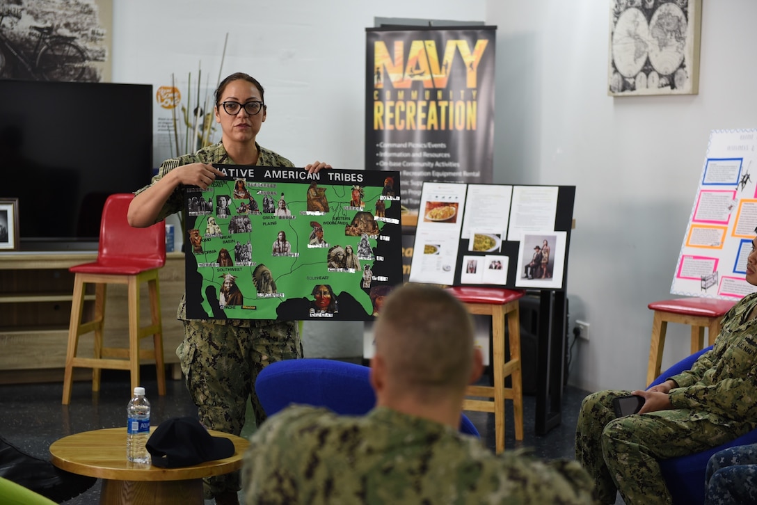 A service member teaches other service members about Native American heritage.