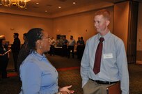 IMAGE: A representative from Naval Surface Warfare Center Dahlgren Division speaks with a potential employee during the 2017 Winter Job Fair at the Fredericksburg Expo and Conference Center, Nov. 28.
