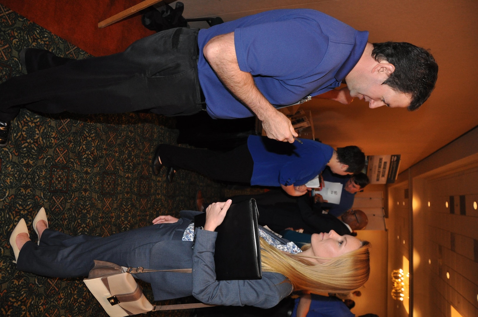 IMAGE: A representative from Naval Surface Warfare Center Dahlgren Division speaks with a potential employee during the 2017 Winter Job Fair at the Fredericksburg Expo and Conference Center, Nov. 28.