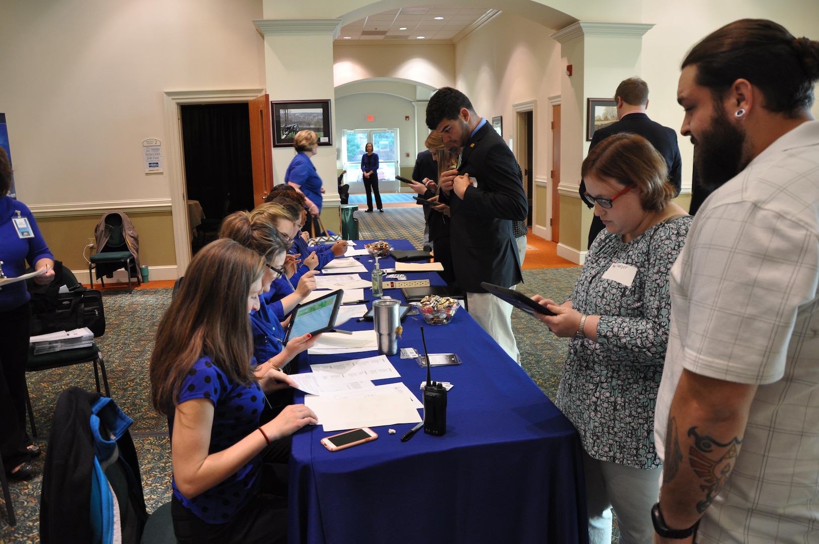 IMAGE: Members of Naval Surface Warfare Center Dahlgren Division’s Human Resources team check-in potential employees during the 2017 Winter Job Fair at the Fredericksburg Expo and Conference Center, Nov. 28.