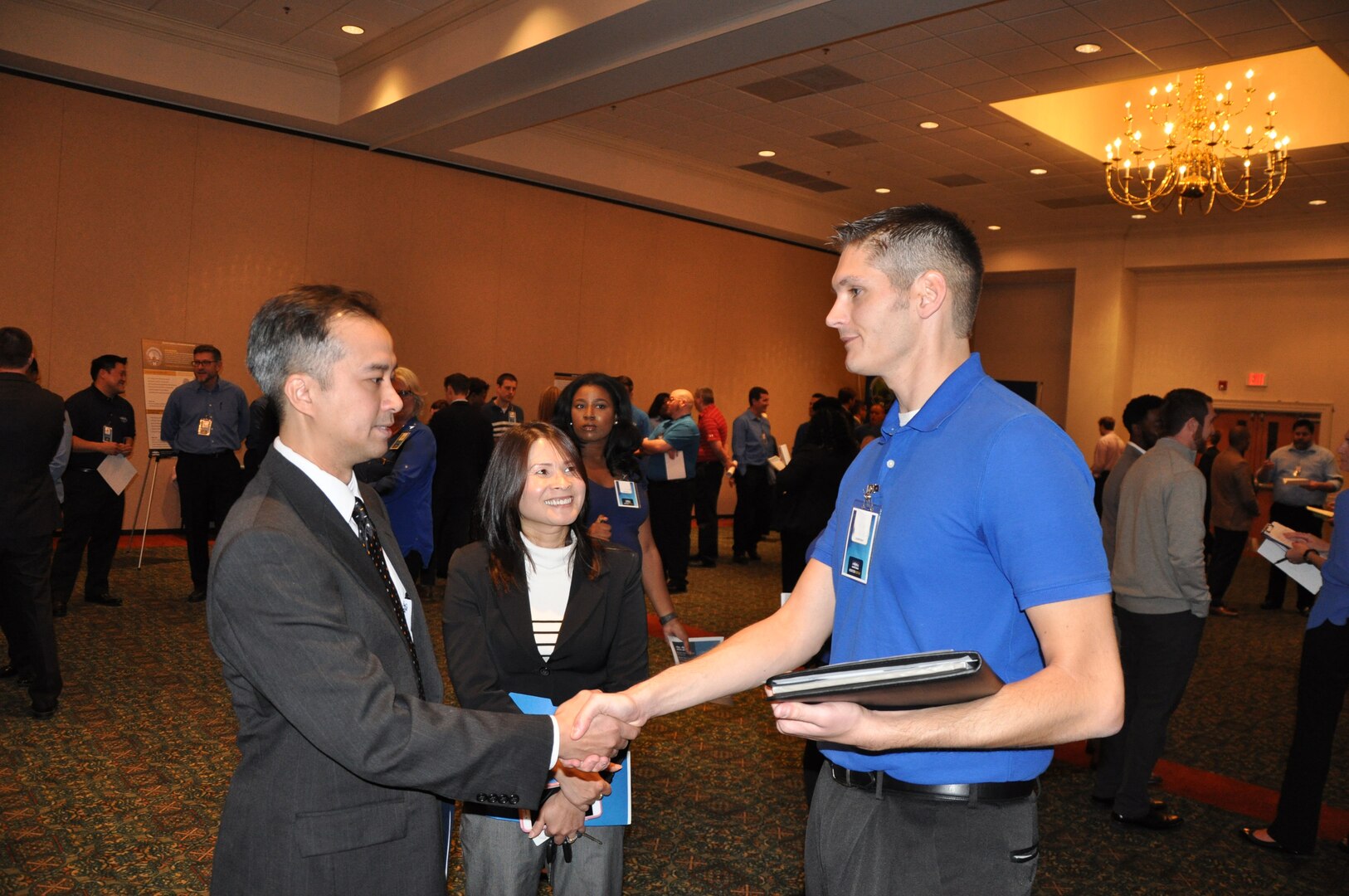 IMAGE: A representative from Naval Surface Warfare Center Dahlgren Division speaks with potential employees during the 2017 Winter Job Fair at the Fredericksburg Expo and Conference Center, Nov. 28