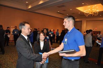 IMAGE: A representative from Naval Surface Warfare Center Dahlgren Division speaks with potential employees during the 2017 Winter Job Fair at the Fredericksburg Expo and Conference Center, Nov. 28