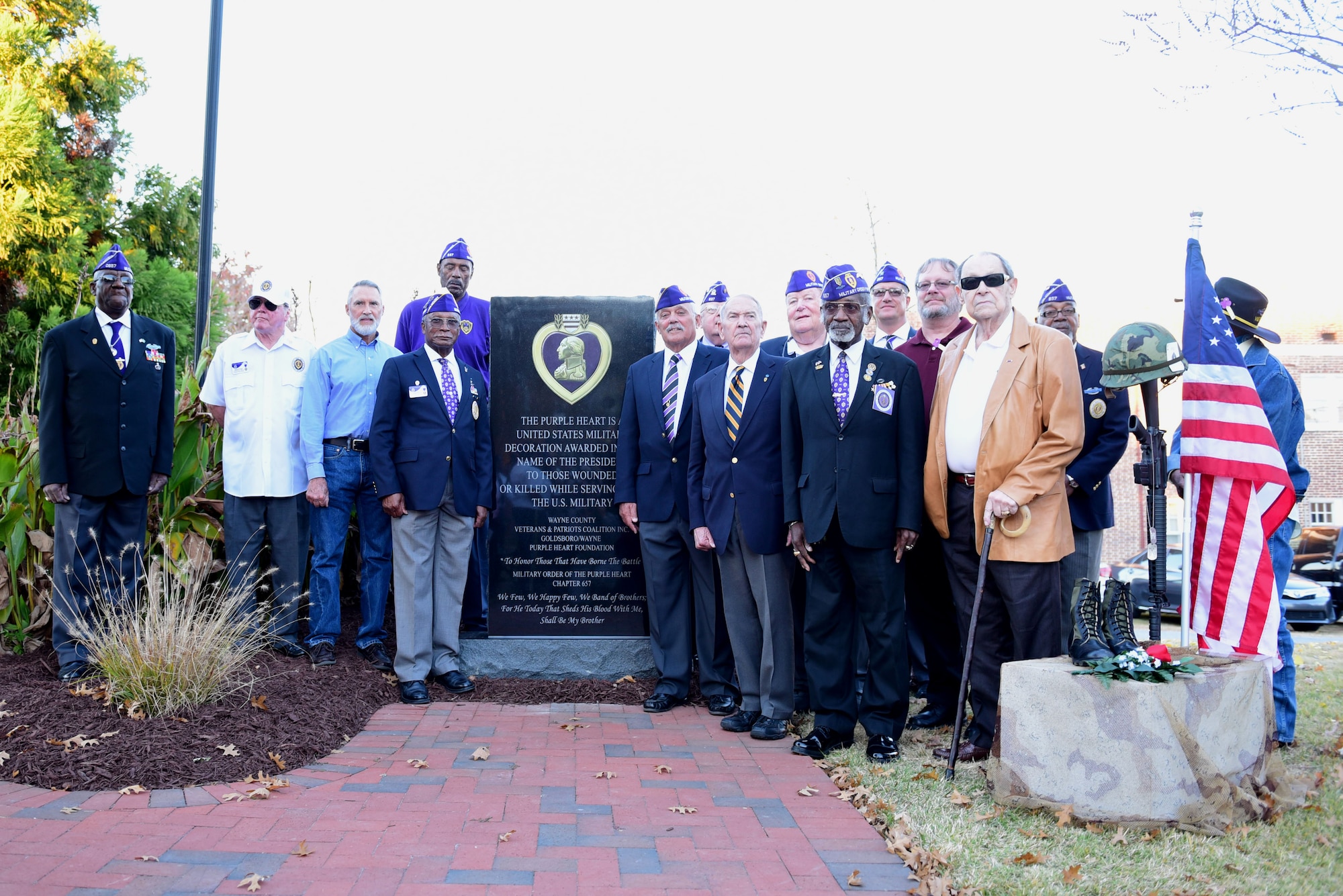 Recipients of the Purple Heart medal gather in front of the newly unveiled Purple Heart memorial Nov. 29, 2017, at the Wayne County Veteran’s Memorial, Goldsboro, North Carolina.