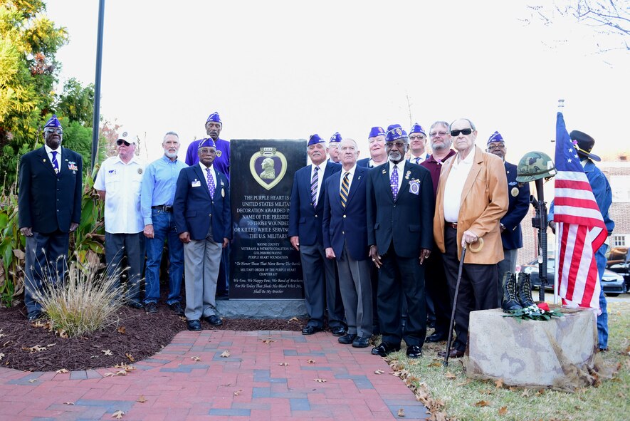 Recipients of the Purple Heart medal gather in front of the newly unveiled Purple Heart memorial Nov. 29, 2017, at the Wayne County Veteran’s Memorial, Goldsboro, North Carolina.