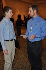 IMAGE: A representative from Naval Surface Warfare Center Dahlgren Division speaks with a potential employee during the 2017 Winter Job Fair at the Fredericksburg Expo and Conference Center, Nov. 28.