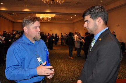 IMAGE: A representative from Naval Surface Warfare Center Dahlgren Division speaks with a potential employee during the 2017 Winter Job Fair at the Fredericksburg Expo and Conference Center, Nov. 28.