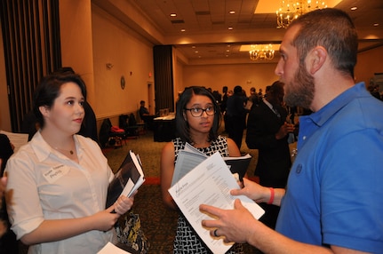 IMAGE: A representative from Naval Surface Warfare Center Dahlgren Division speaks with potential employees during the 2017 Winter Job Fair at the Fredericksburg Expo and Conference Center, Nov. 28.