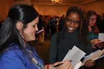 IMAGE: A representative from Naval Surface Warfare Center Dahlgren Division speaks with a potential employee during the 2017 Winter Job Fair at the Fredericksburg Expo and Conference Center, Nov. 28.