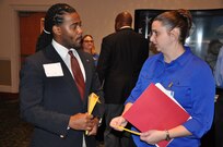 IMAGE: A representative from Naval Surface Warfare Center Dahlgren Division speaks with a potential employee during the 2017 Winter Job Fair at the Fredericksburg Expo and Conference Center, Nov. 28.