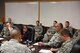 Ms. Linda Halverson, Air Combat Command Air Force Distributed Common Ground System Weapons System Team chief, listens as U.S. Air Force Col. Alejandro Ganster, 17th Training Group commander, speaks during a meeting in the Brandenburg Hall on Goodfellow Air Force Base, Texas, Nov. 29, 2017. Halverson, as part of Air Combat Command, ended her visit with a meeting about increasing the base’s network speeds. (U.S. Air Force photo by Airman 1st Class Zachary Chapman/Released)