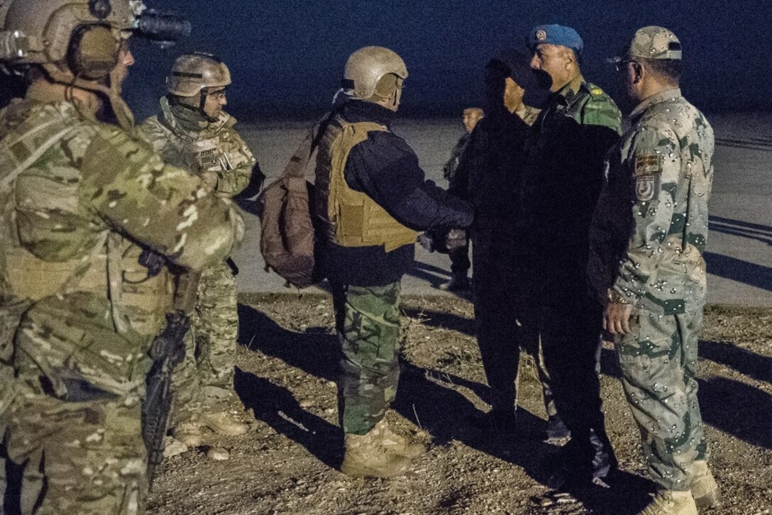 An Afghan Air Force leader meets with Special Tactics Airmen from the Air Force Special Operations Command to discuss plans to increase airpower at airfields in Faryab province, Afghanistan, Nov. 29, 2017. The Special Tactics airmen ensure access to traditional airfields and field landing strips to increase the operational reach of coalition and Afghan aircraft for reconnaissance, troop delivery, and strategic air support operations. (U.S. Air Force photo by Staff Sgt. Doug Ellis)