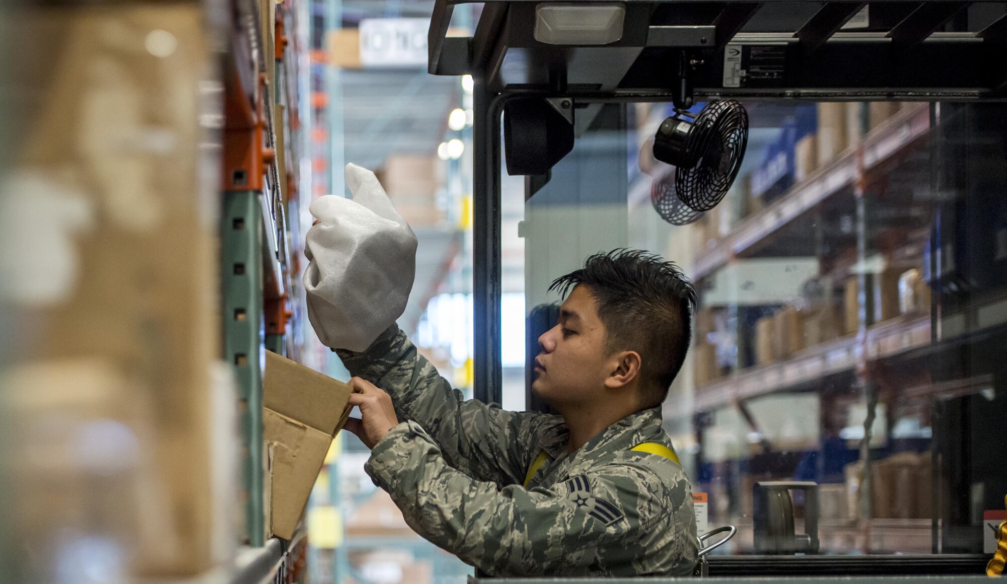Senior Airman Nicoli Martin Leuterio, 366th Logistics Readiness Squadron material management journeyman, checks over a package at Mountain Home Air Force Base, Idaho, Nov. 29, 2017.