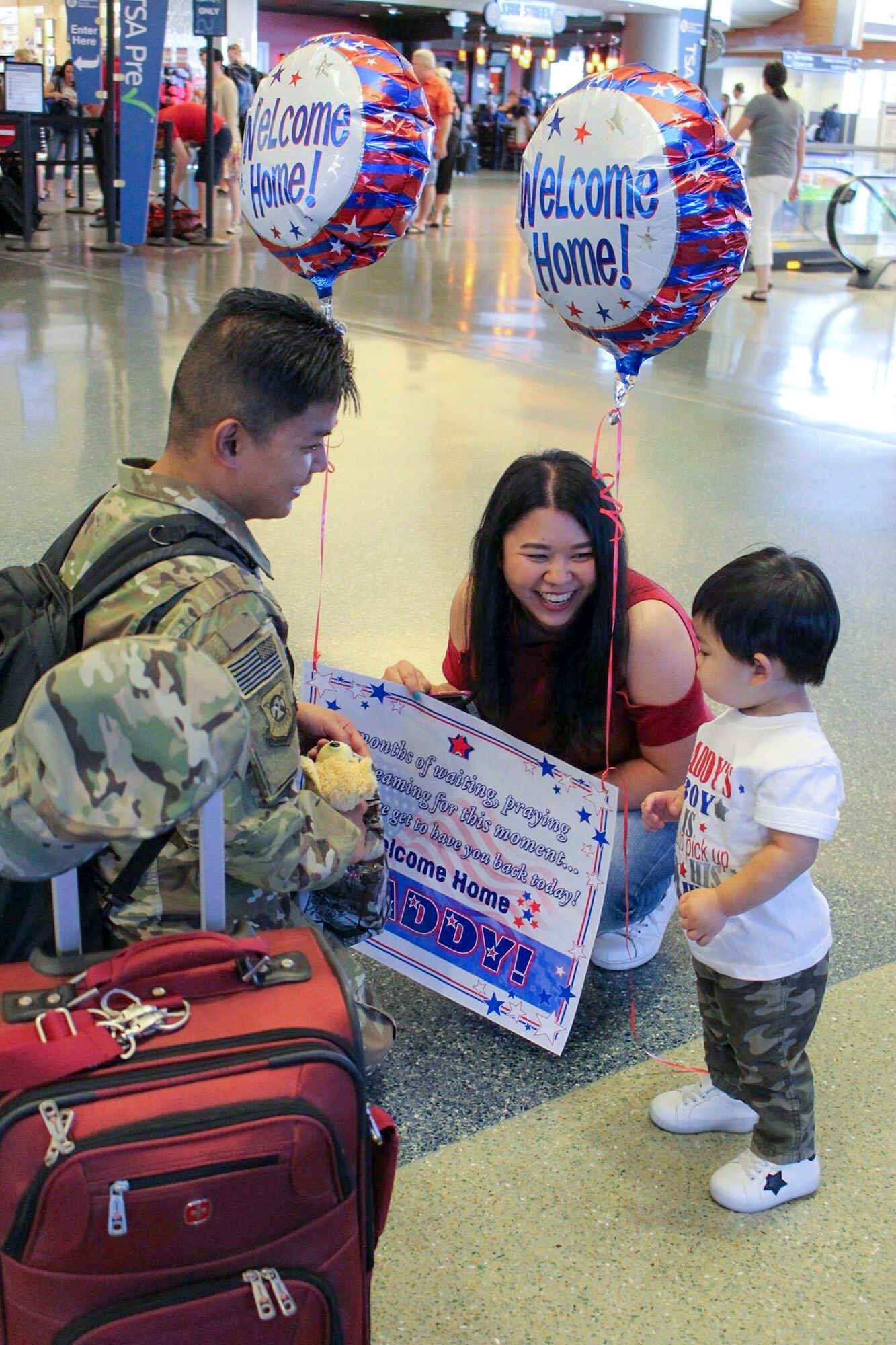Senior Airman Nicoli Martin Leuterio's, 366th Logistics Readiness Squadron material management journeyman, family welcomes him home at the Boise Airport in Boise, Idaho.