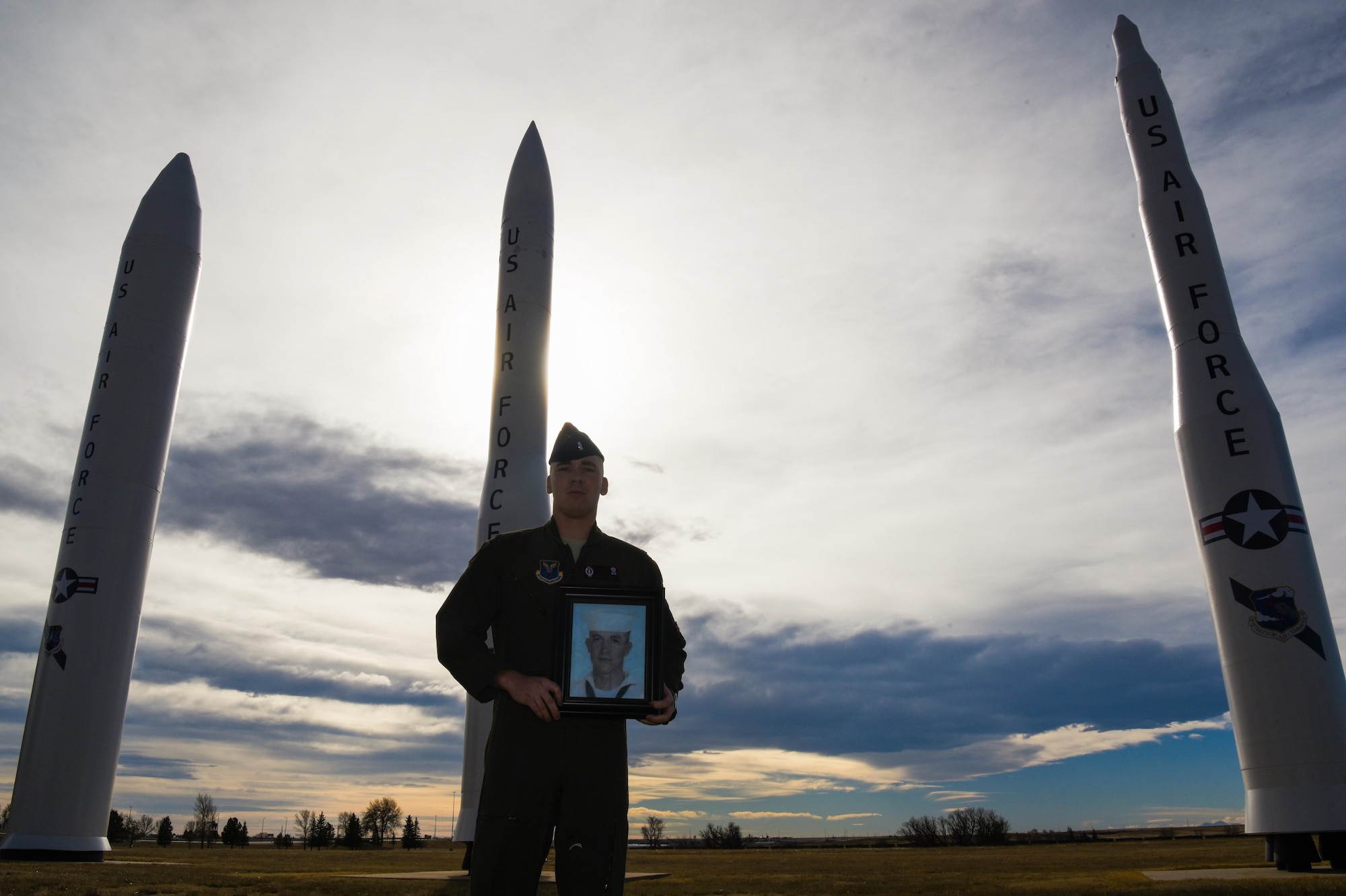 1st Lt. Tyler Lindquist, 320th nuclear and missile crew commander, holds a picture of Medal of Honor recipient Marvin Glenn Shields at F.E. Warren Air Force Base, Wyo., Nov. 29, 2017. Shields created a lasting impact on Lindquist as his great uncle, which resulted in his choice to serve a career within the U.S. Air Force. (U.S. Air Force photo by Airman 1st Class Abbigayle Wagner)