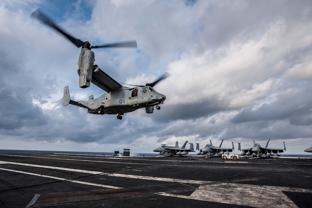 An MV-22B Osprey of Marine Medium Tiltrotor Squadron (VMM) 265 lands on the flight deck of the Navy’s forward-deployed aircraft carrier, USS Ronald Reagan (CVN 76). Ronald Reagan, the flagship of Carrier Strike Group 5, provides a combat-ready force that protects and defends the collective maritime interests of its allies and partners in the Indo-Asia-Pacific region.
