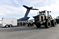 Airmen load cargo onto a C-17 Globemaster III aircraft in preparation for Hurricane Maria relief efforts, at Travis Air Force Base, Calf., Sept. 30. The aircraft from March Air Reserve Base, Calif., will deliver a 65-member Contingency Response Element to Aguadilla, Puerto Rico to establish command and control of the airfield and provide aerial port and maintenance support during Hurricane Maria relief efforts.  (U.S. Air Force photo by Tech. Sgt. Liliana Moreno/Released)