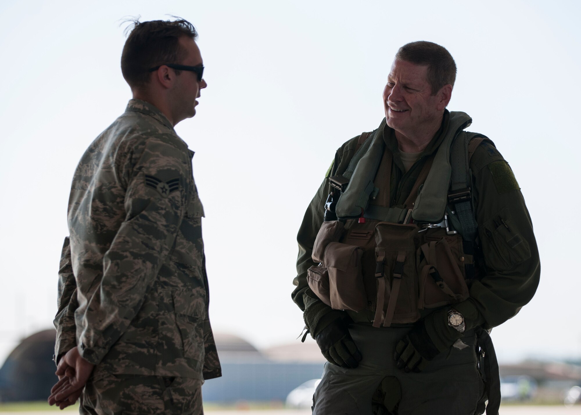 U.S. Air Force Gen. Robin Rand, Air Force Global Strike Command commander, speaks with Senior Airman Samuel Daniels, 80th Air Maintenance Squadron crew chief, before his flight in an F-16 Fighting Falcon at Kunsan Air Base, Republic of Korea, Sept. 28, 2017. Rand, a former 8th Fighter Wing commander affectionately known as Wolf 42, reconnected with the base and the mission through visits with Airmen, base leadership, and spoke to the important role that both AFGSC and the Wolf Pack play in supporting the Korean peninsula and pacific region. (U.S. Air Force photo by Staff Sgt. Victoria H. Taylor)