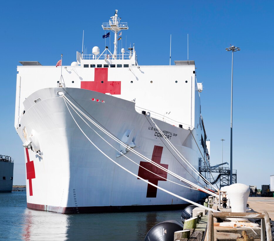 The Military Sealift Command hospital ship USNS Comfort is pier side as crew members on load supplies in preparation to depart Norfolk Naval Station.