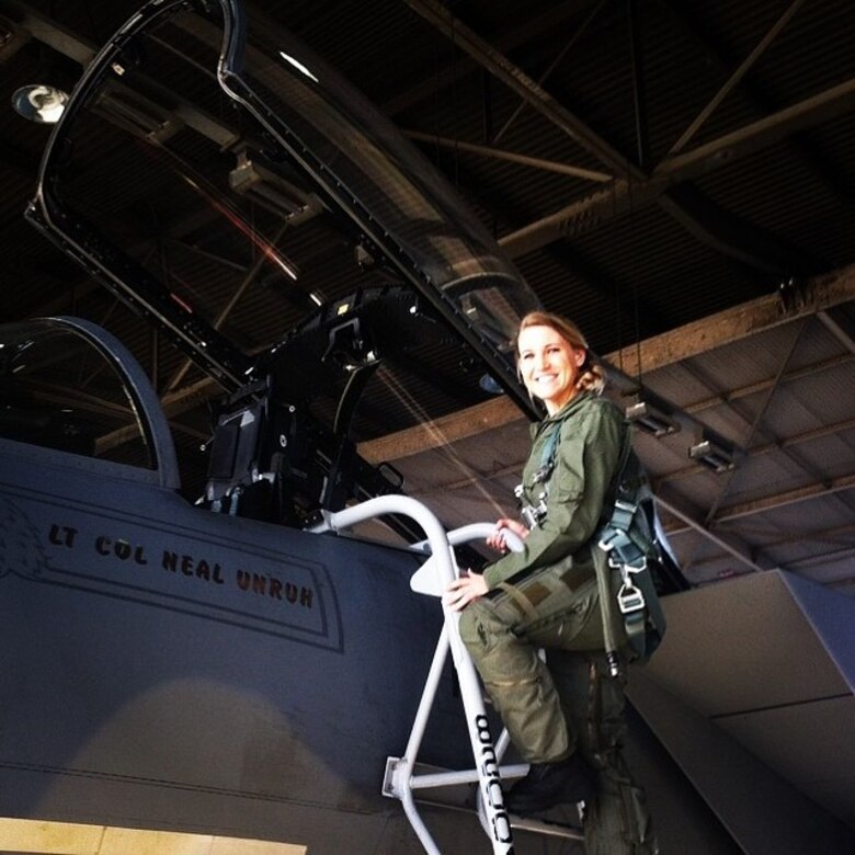 Air Force captain boards an F-15 fighter jet.