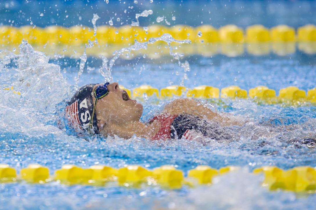 Navy Petty Officer 3rd Class Melissa Klotz competes in swimming backstroke during Invictus Games 2017.