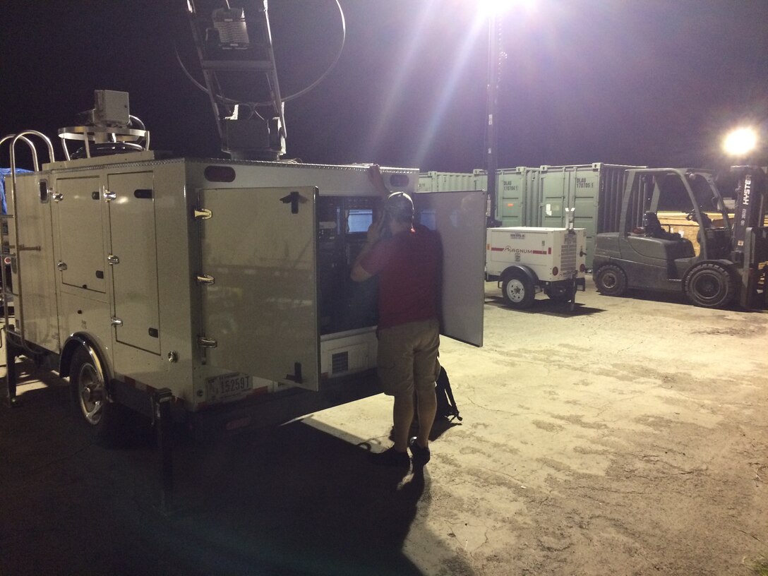 Charles James of the Contingency IT team is working on the Mobile Emergency Response Center equipment during their recent deployment in support of the hurricane relief efforts.