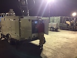 Charles James of the Contingency IT team is working on the Mobile Emergency Response Center equipment during their recent deployment in support of the hurricane relief efforts.
