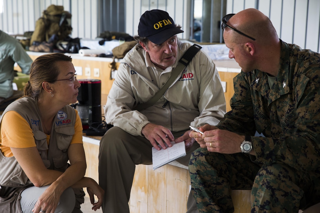 U.S. officials discuss humanitarian assistance and disaster relief operations in Roseau, Dominica.