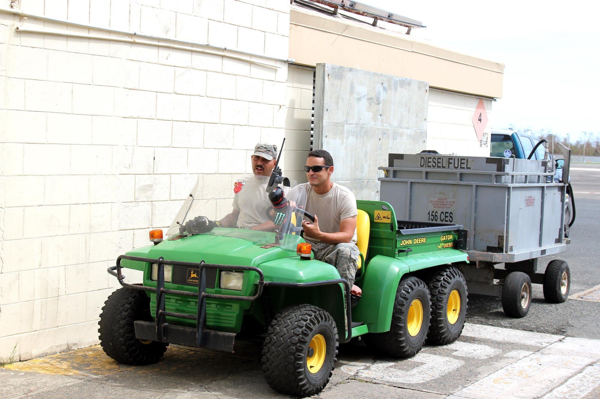 Airman 1st Class Pedro Pedraza and Staff Sgt. Carlos Arroyo travel to a generator location at Muniz Air National Guard Base, Oct. 1, 2017. The two Airmen are members of the Puerto Rico Air National Guard and are working to keep the generators running at the air base. The Puerto Rico Air National Guard is working with many federal and local agencies in response to the damage caused to Puerto Rico by Hurricane Maria, which hit the island territory on Sept. 20, 2017. (U.S. Air National Guard photo by Tech. Sgt. Dan Heaton)