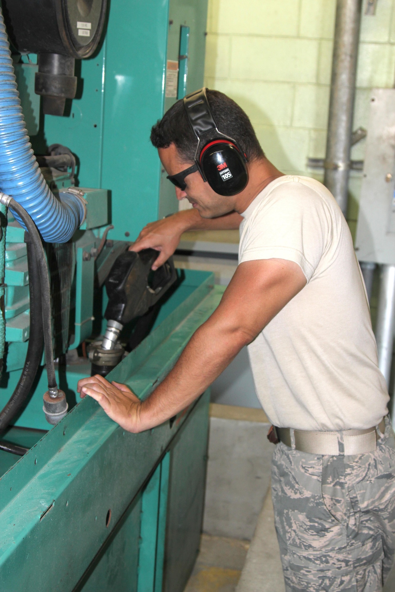 Staff Sgt. Carlos Arroyo, a power production specialist with the 156th Civil Engineer Squadron, works on refueling a generator at Muniz Air National Guard Base, Oct. 1, 2017. The Puerto Rico Air National Guard is working with many federal and local agencies in response to the damage caused to Puerto Rico by Hurricane Maria, which hit the island territory on Sept. 20, 2017. (U.S. Air National Guard photo by Tech. Sgt. Dan Heaton)