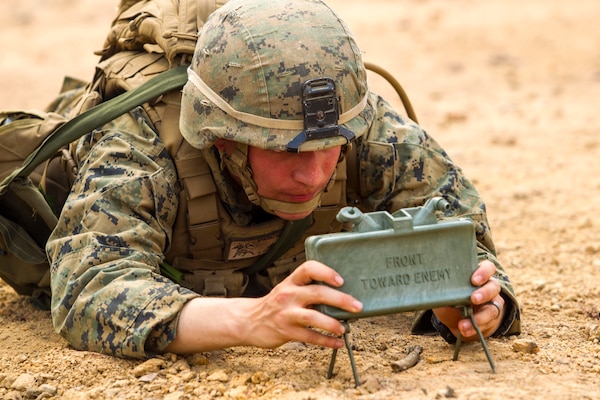 Marine sets up M18A1 claymore mine during Exercise Cobra Gold, February 14, 2014, at Ban Chan Krem, Kingdom of Thailand (U.S. Marine Corps/Adam Miller)