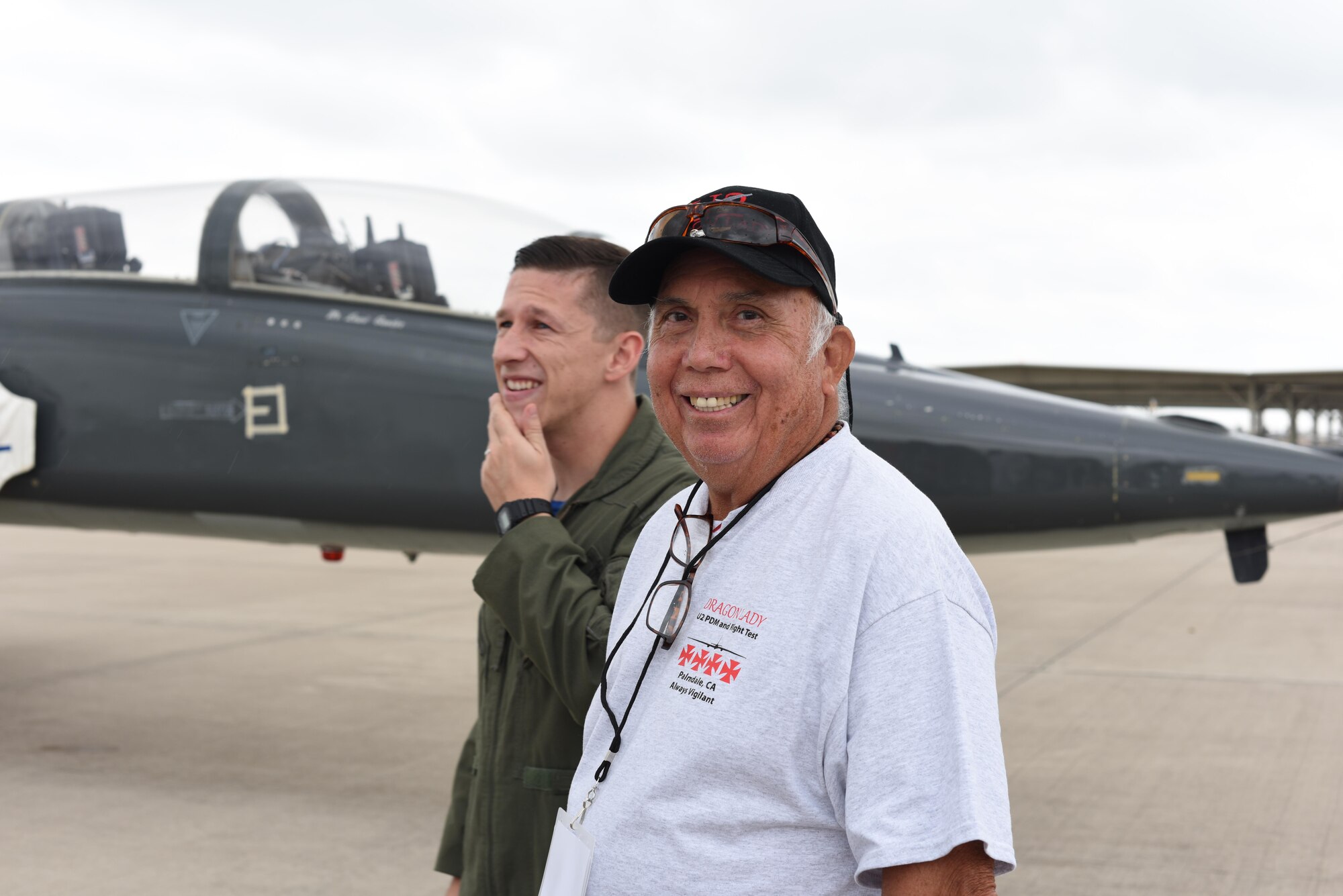 Fabian Fonseca, former 4080th Strategic Reconnaissance Wing armament and electronics for the U-2 Dragon Lady, socializes with 2nd Lt. Leslie Johnston IV, 47th Student Squadron pilot, on the flightline at Laughlin Air Force Base, Texas, Sept. 22, 2017. The 4080th SRW reunions are an opportunity for the Airmen of the 4080th SRW to relate to the Airmen currently stationed at Laughlin.