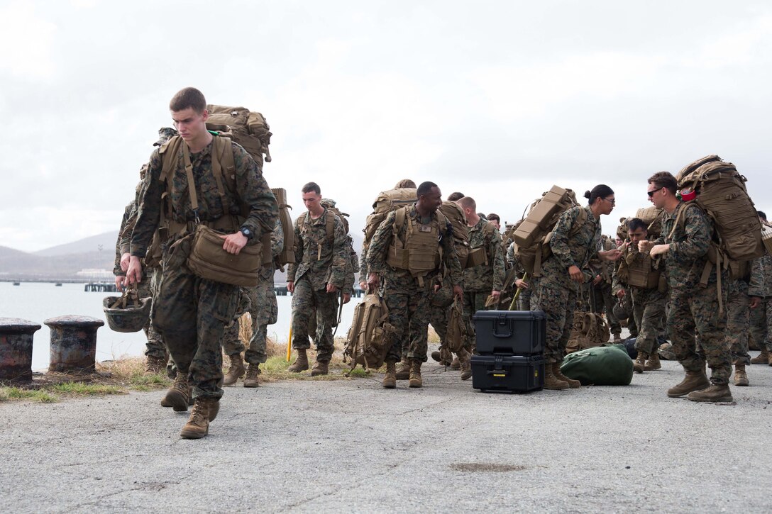 U.S. Marines with the 26th Marine Expeditionary Unit (MEU), prepare to board Landing Craft, Utility 1654 assigned to amphibious assault ship USS Kearsarge, to return to ship after supporting Hurricane Maria relief efforts at Ceiba, Puerto Rico, Sept. 29, 2017. The 26th MEU is supporting Federal Emergency Management Agency, the lead federal agency, in helping those affected by Hurricane Maria to minimize suffering and is one component of the overall whole-of-government response effort. (U.S. Marine Corps photo by Lance Cpl. Alexis C. Schneider)
